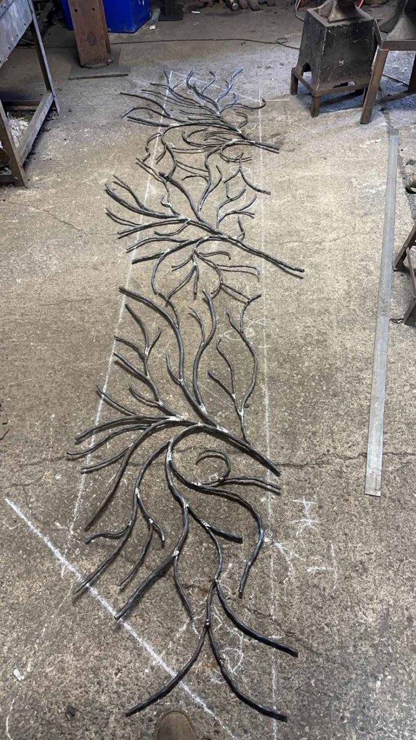 Flowing forged branch-and-foliage decorative ironwork panel