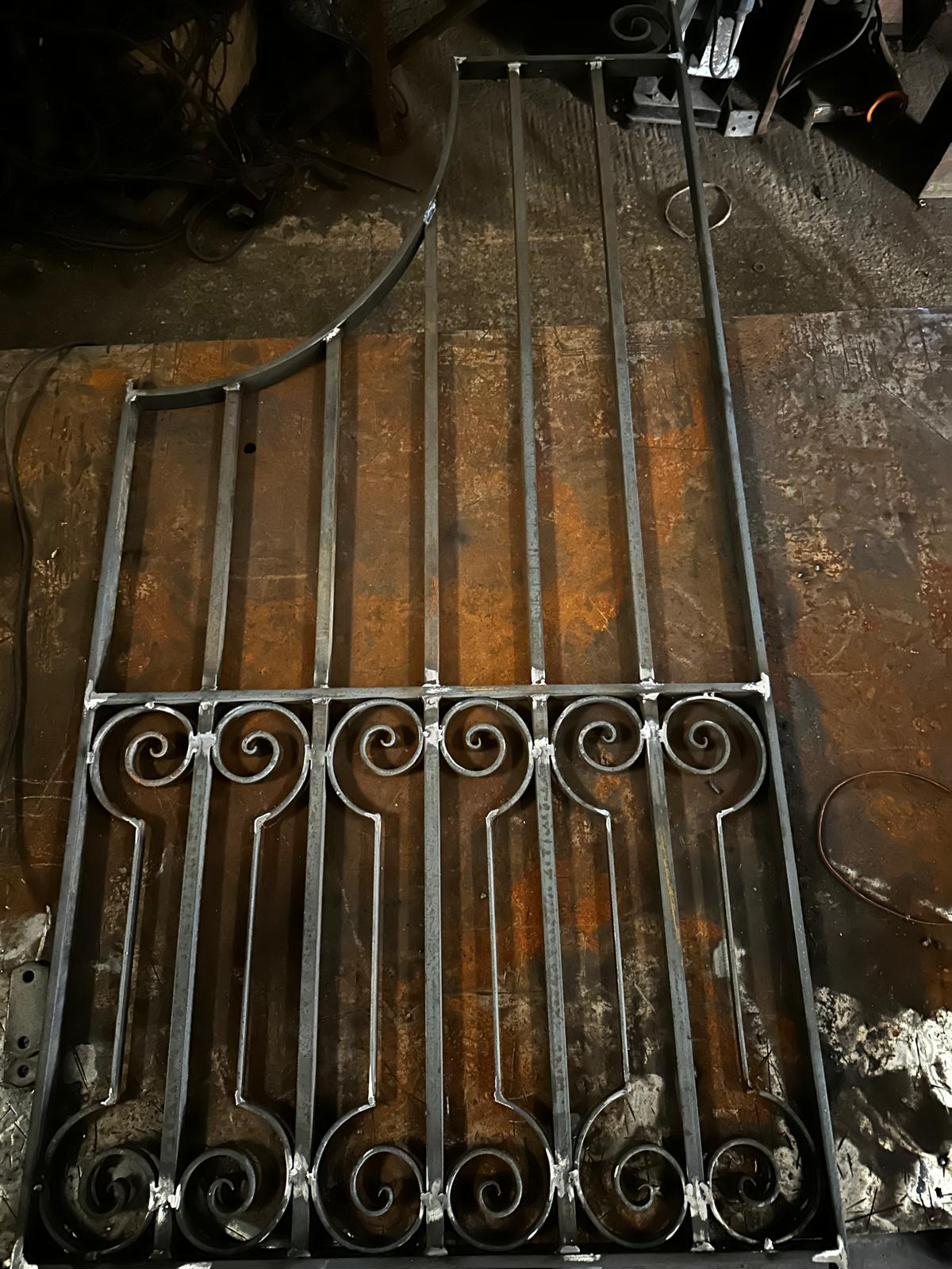 Hand-scrolled iron gate panel