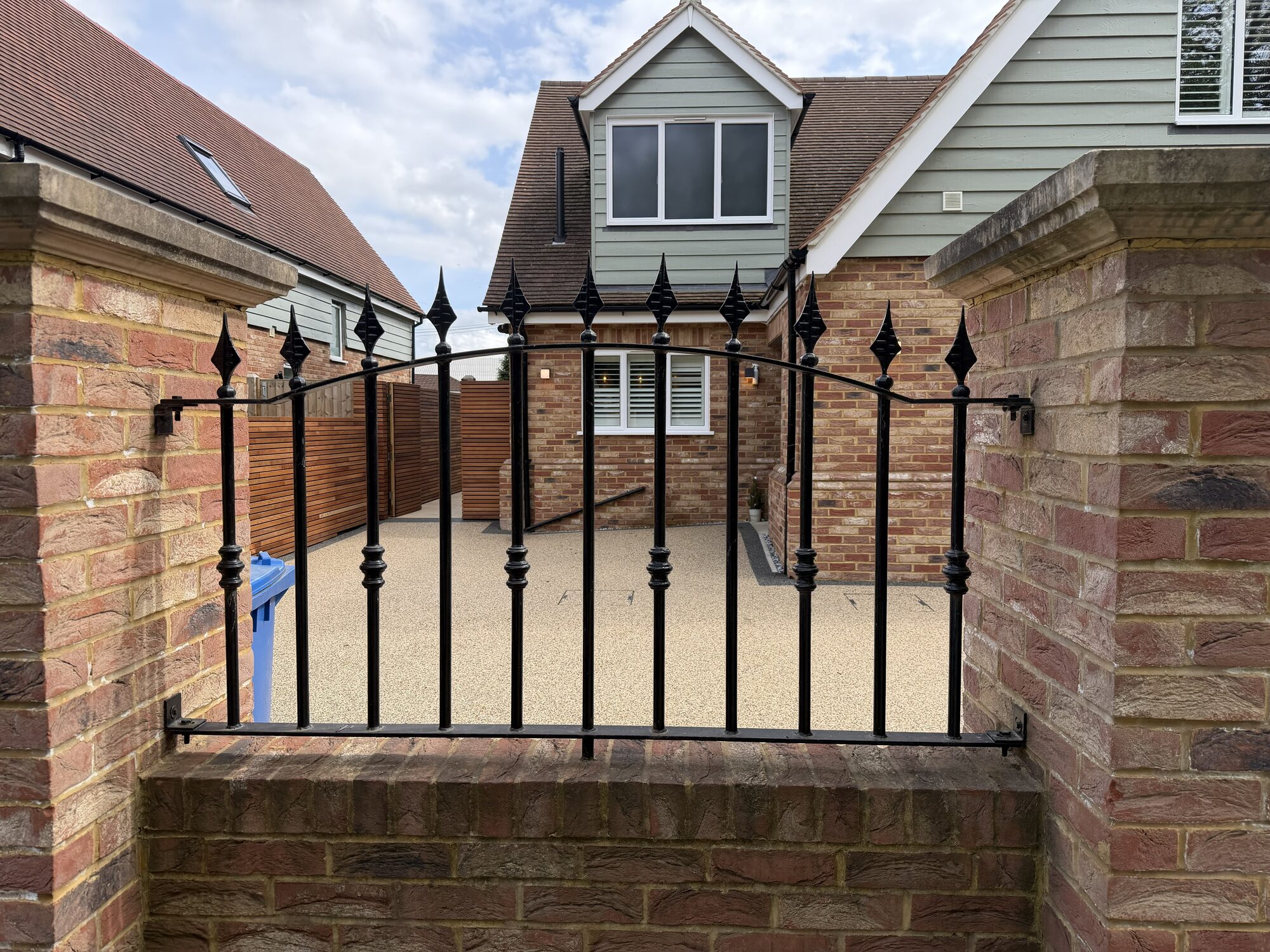 Double driveway gate with diamond finials by Lordran Forge