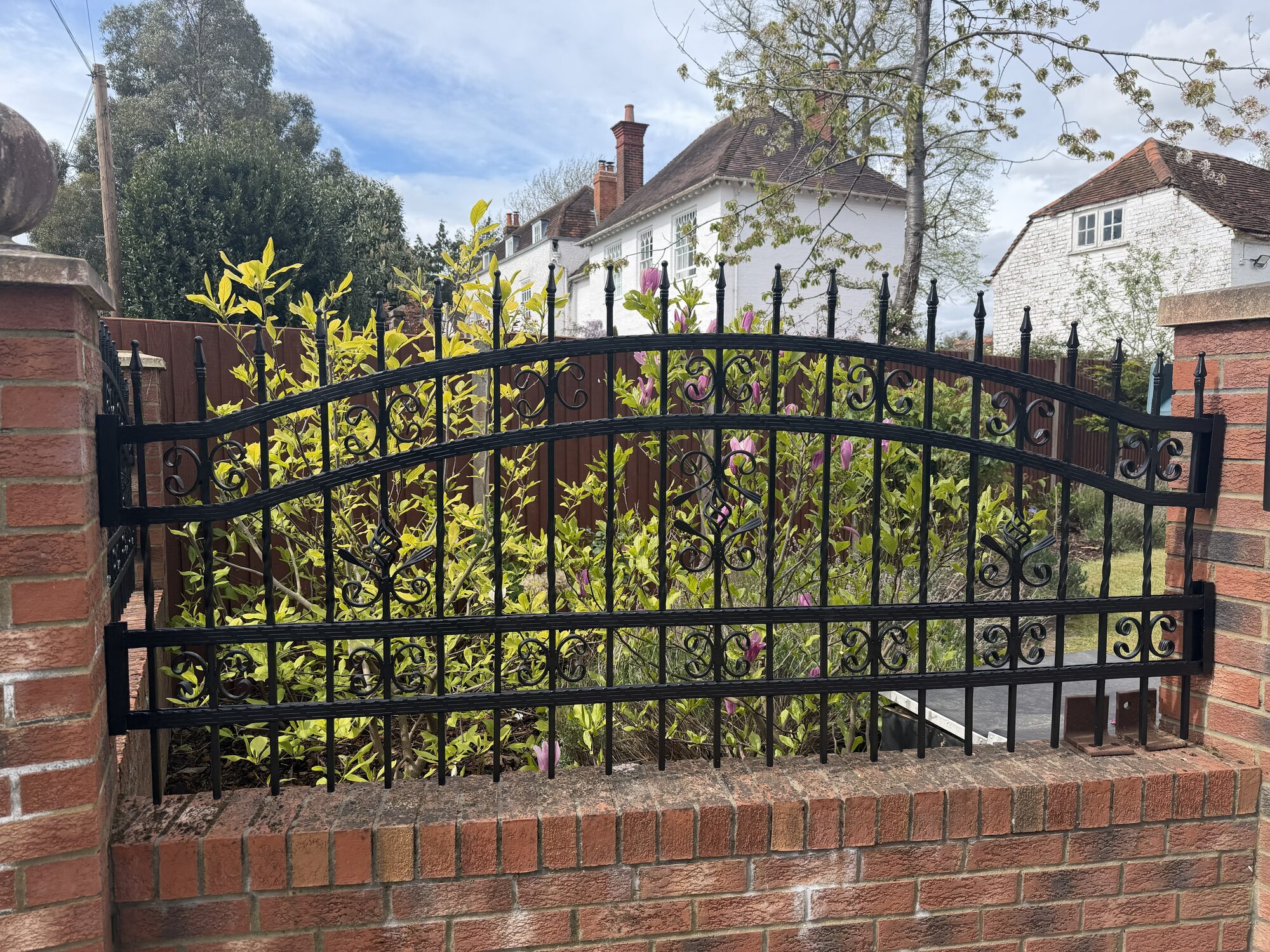 Hand-forged ornate scrollwork gate by Lordran Forge