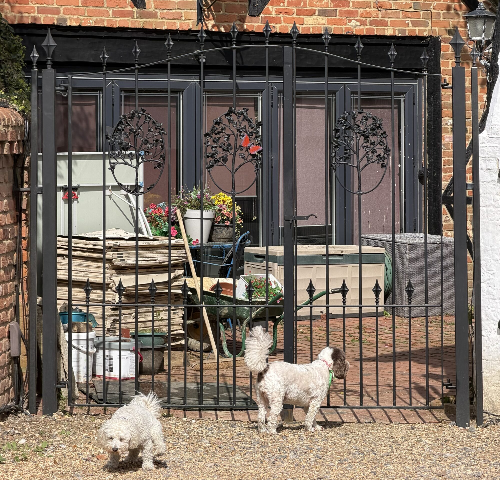 Bespoke double gate with three tree-of-life forged panels