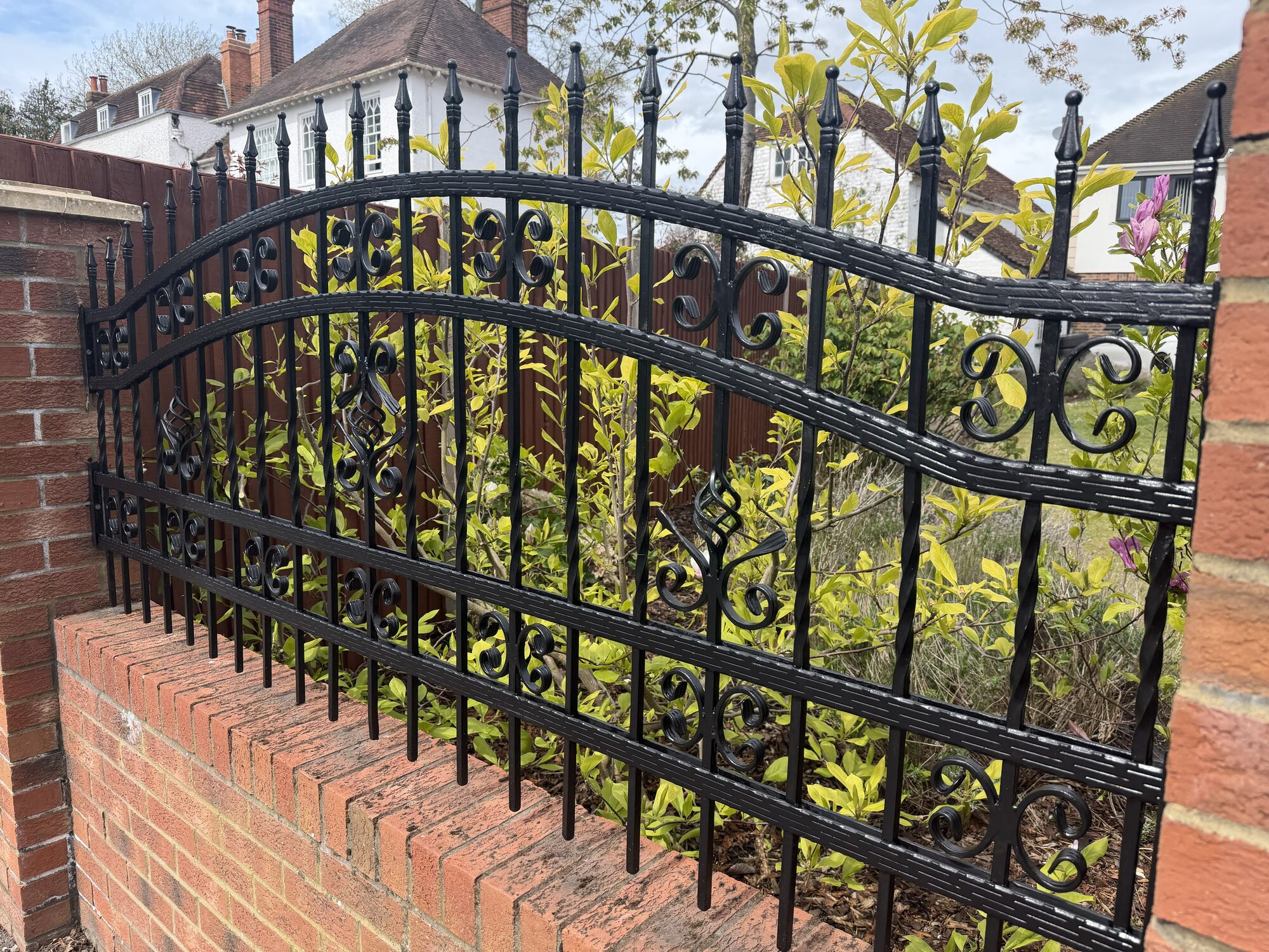 Ornate scrollwork railings with twisted detail by Lordran Forge