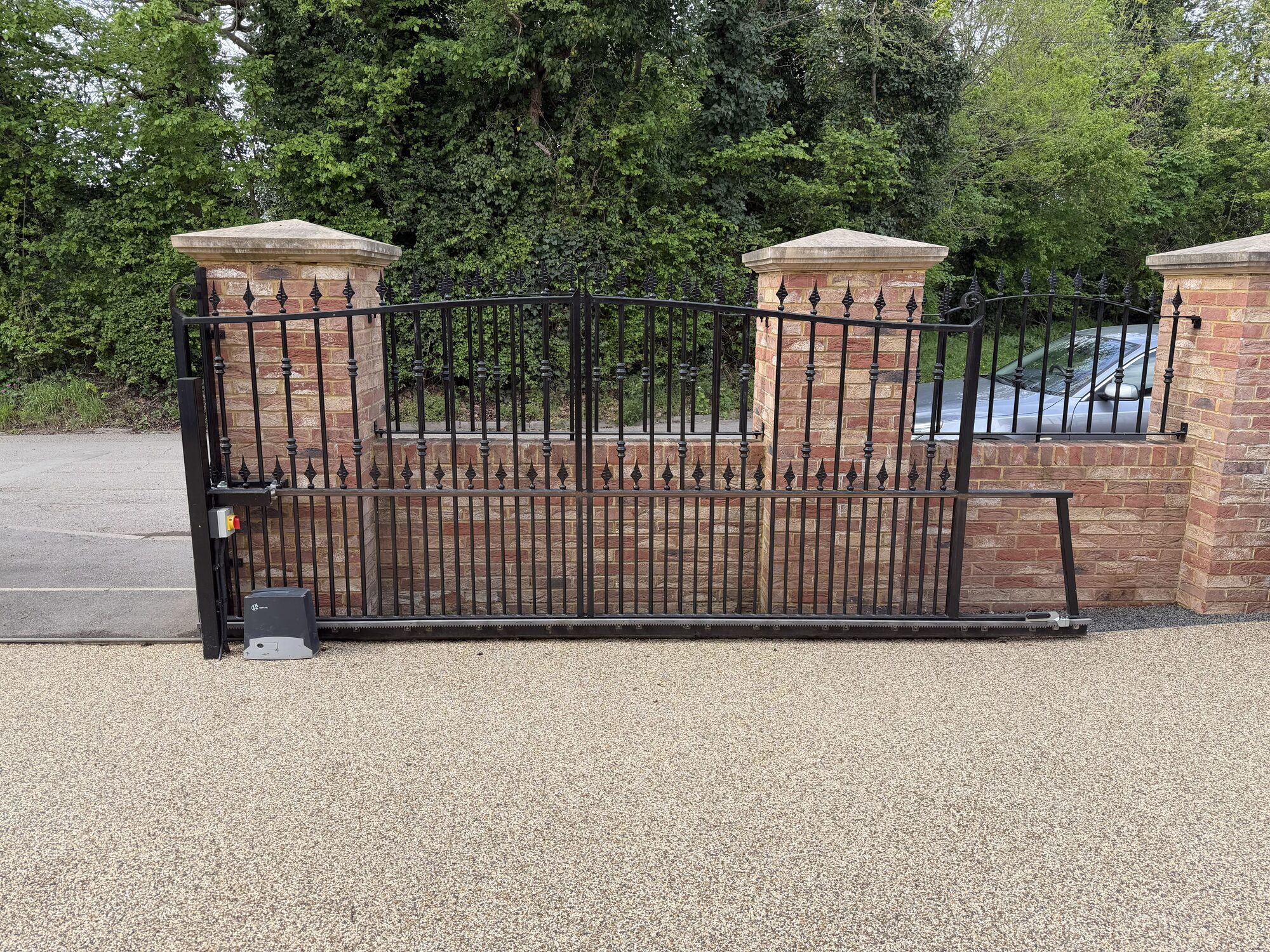 Ornate scrollwork wall-top railings with twisted bar detail