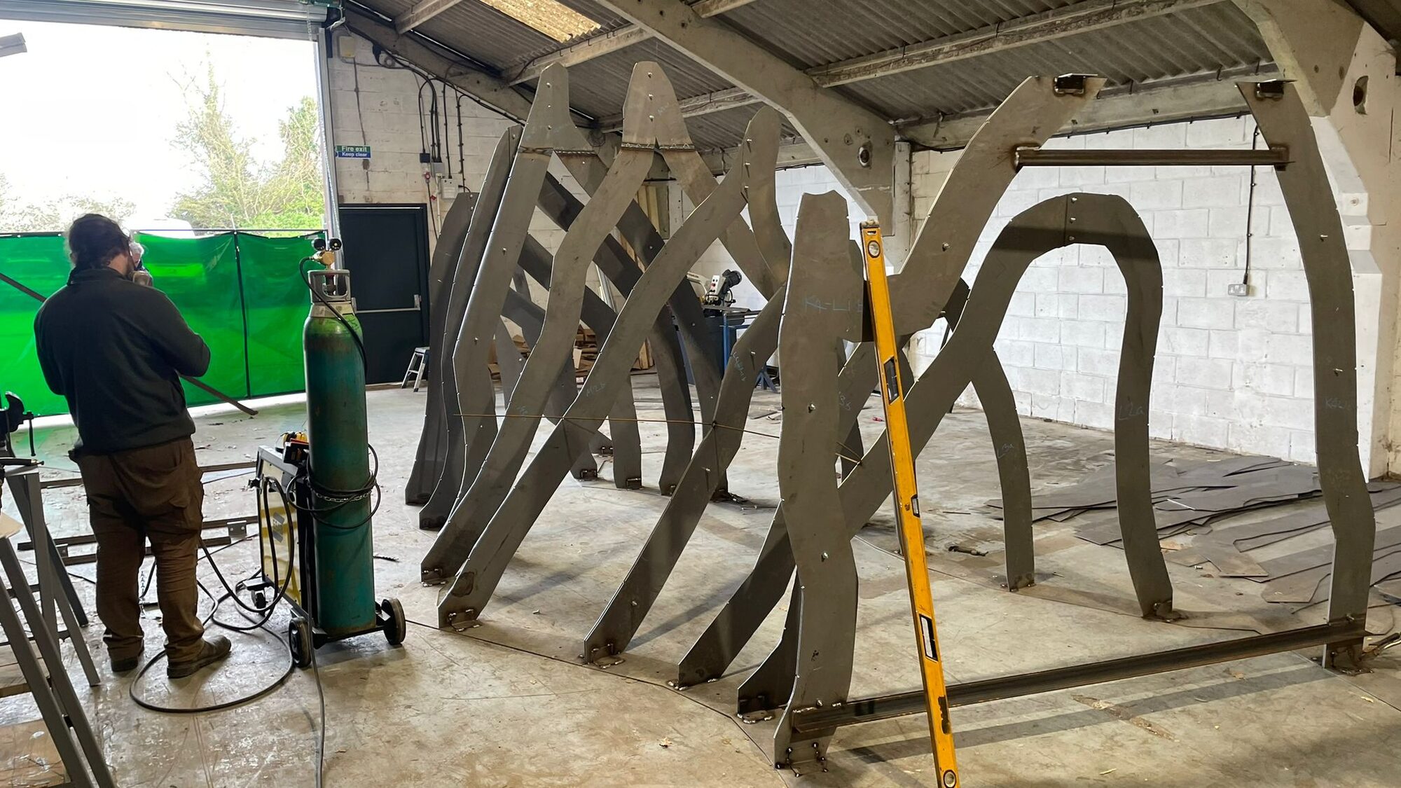 Large welded steel armature sections standing in the workshop
